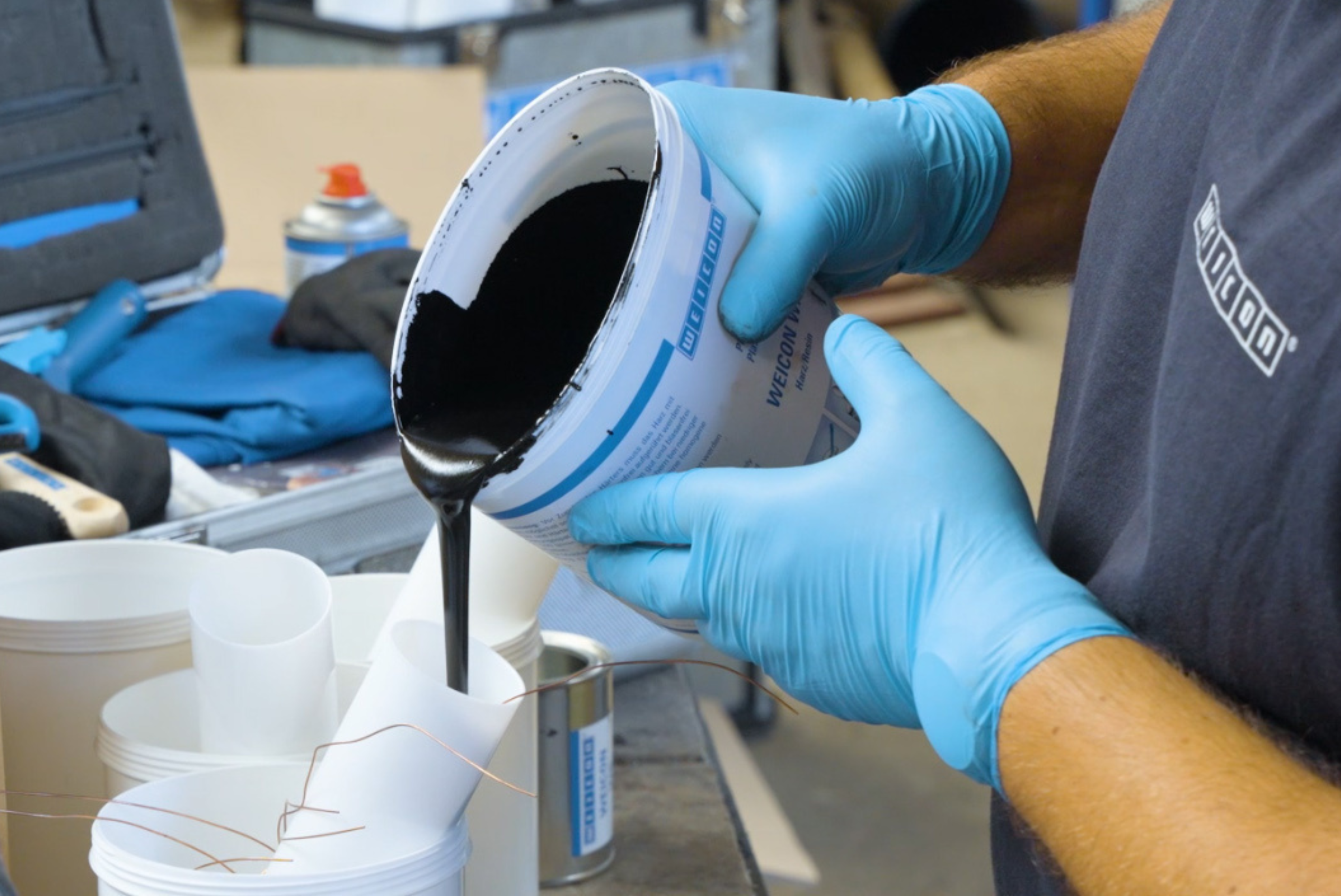 paint, paint can, black liquid, gloves, workshop