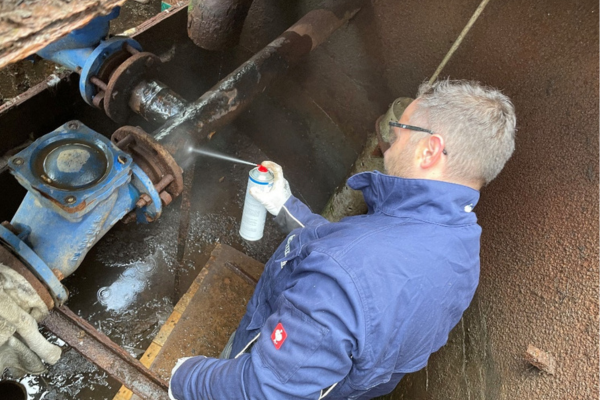 protective gear, work gloves, spray bottle, maintenance, industrial setting