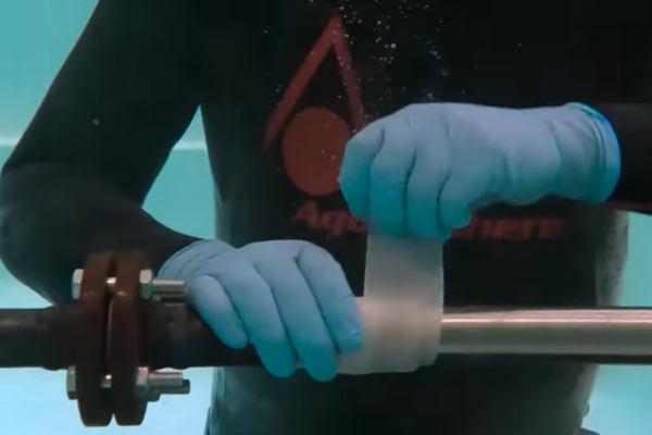 gloves, gloved hands, metal rod, clamp, sleeve